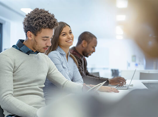 People in a meeting working.