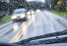 Car windshield in rainy weather.