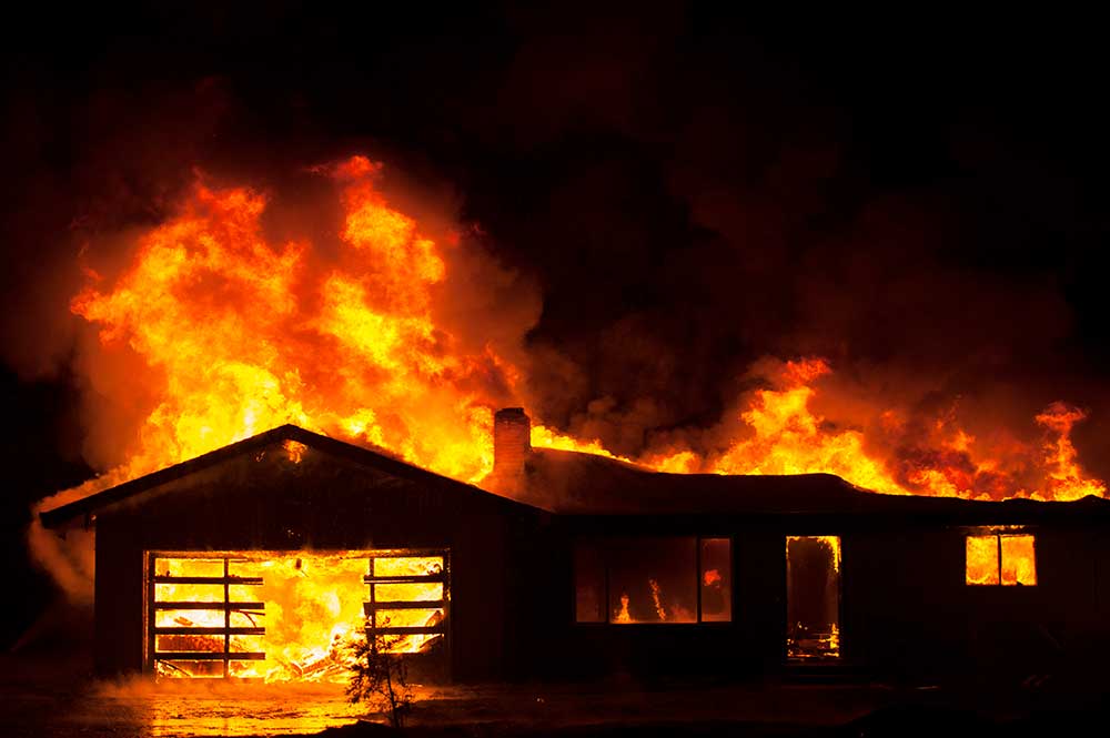 A house engulfed by flames.