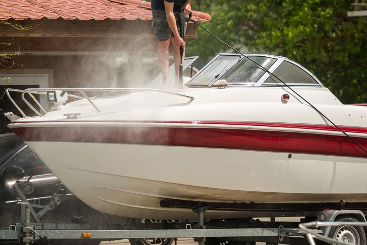 Person washing their boat.